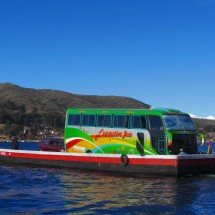 Large bus on a little boat